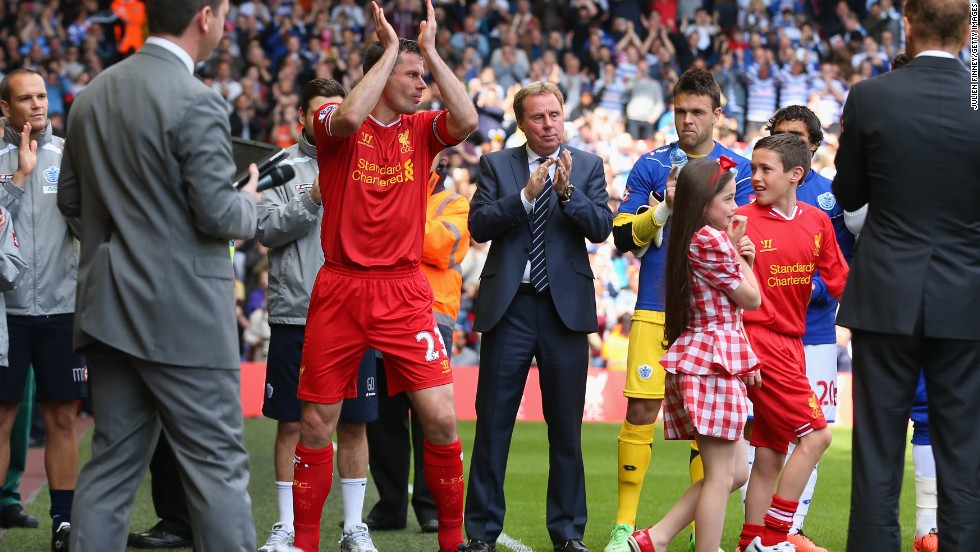 Jamie Carragher is applauded on to the pitch for his final game for Liverpool against Queens Park Rangers.