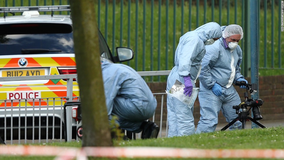 Forensic officers investigate the crime scene on May 22.