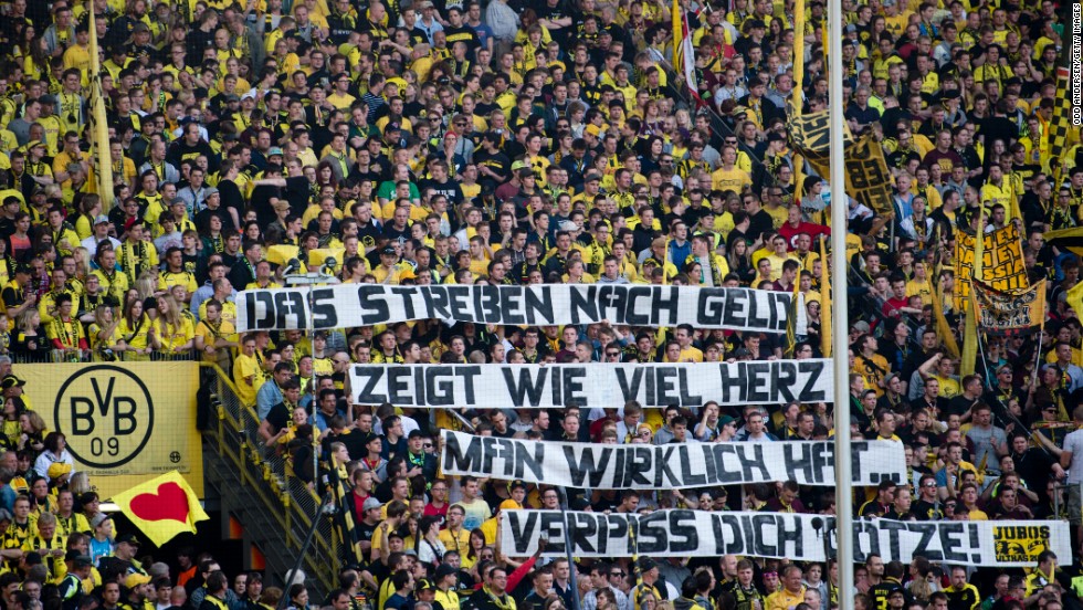 A banner reads &#39;The quest for cash reveals how much heart you really have, get lost Gotze&#39; as Dortmund hosted Bayern Munich on May 4. 
