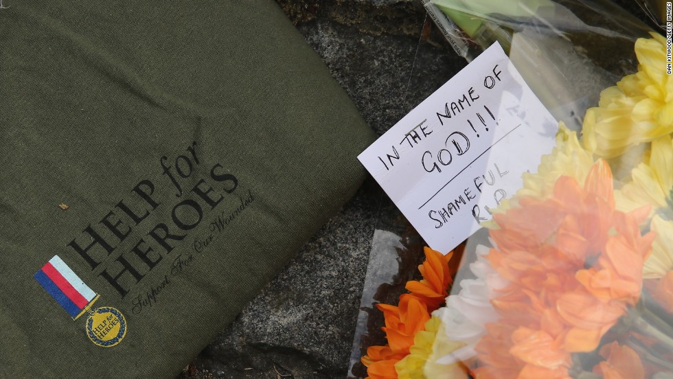 Notes and shirts sit outside Woolwich Barracks on May 23. The slain soldier was wearing a &quot;Help for Heroes&quot; shirt when he was killed. 