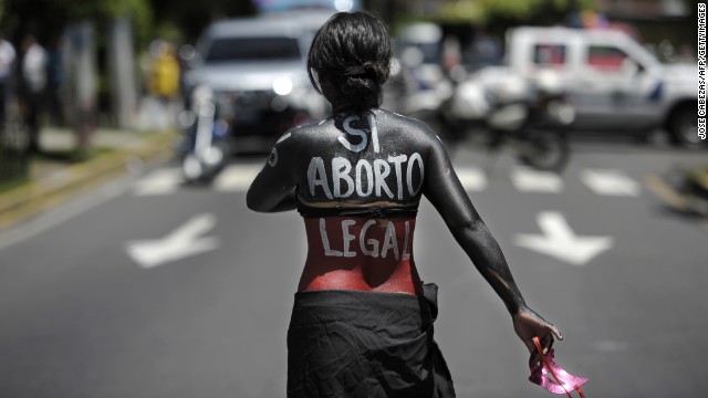 (File) A woman marches on the International Day of Action for the Decriminalization of Abortion in San Salvador.