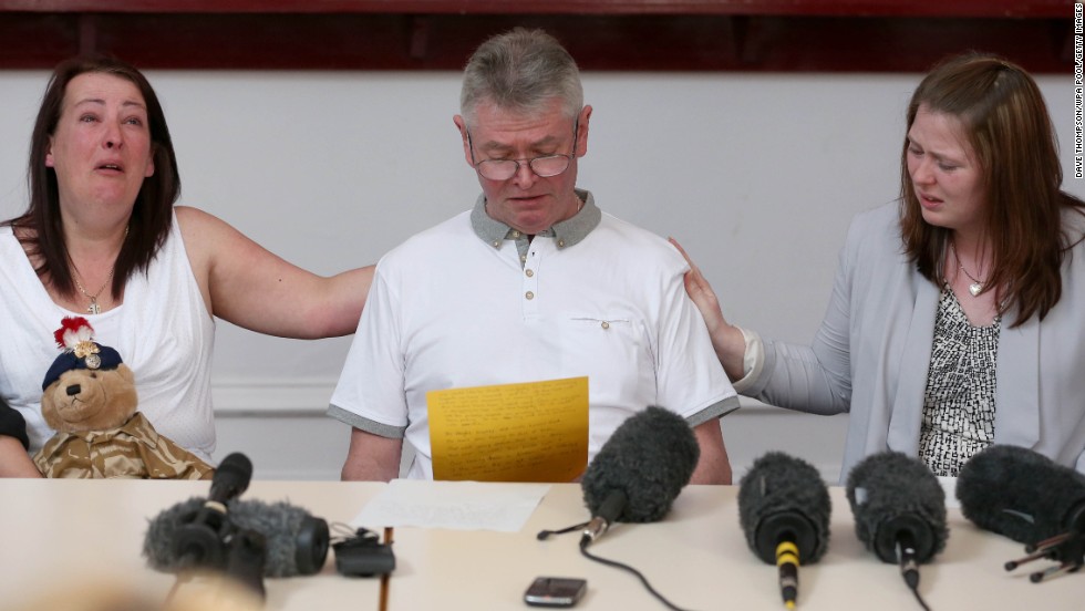 From left, Lyn Rigby, mother of the slain soldier, stepfather Ian Rigby and Lee&#39;s wife Rebecca Rigby grieve as Ian reads a family statement on Friday, May 24, in Bury, England.