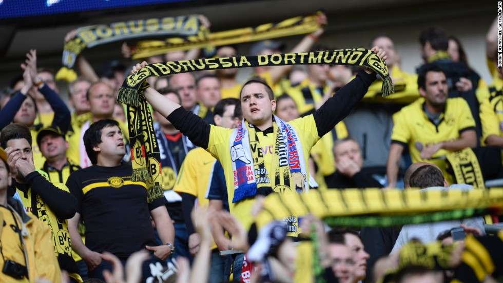 Borussia Dortmund supporters fill the stands as they wait for their team to take the field.