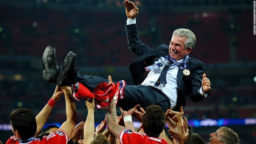 Bayern Head Coach Jupp Heynckes is carried by his players after winning the UEFA Champions League final.