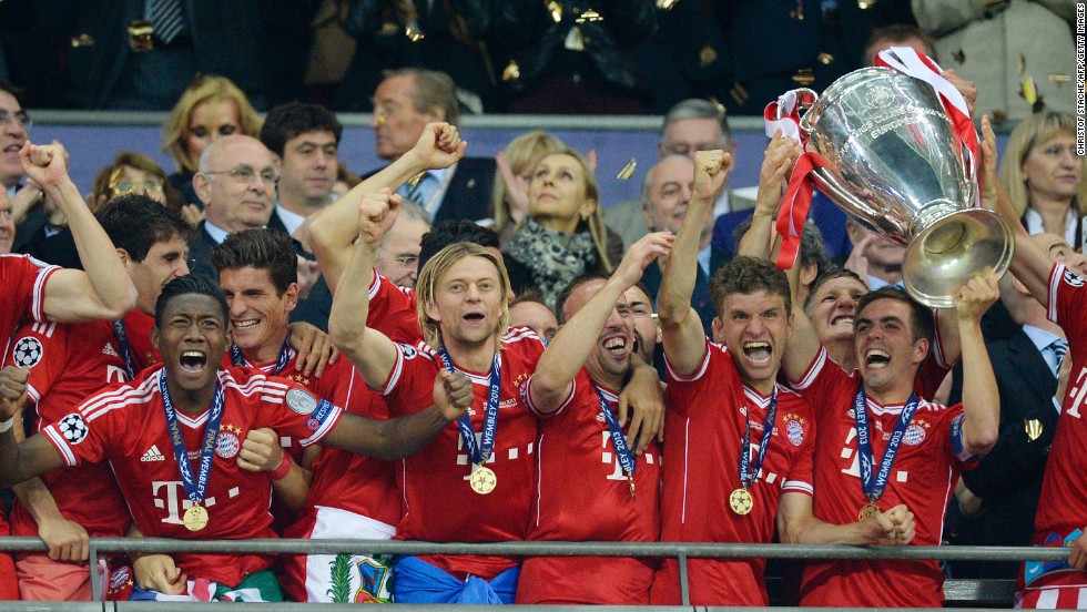 Bayern Munich players lift the trophy as they celebrate winning the UEFA Champions League final after beating Borussia Dortmund 2-1 at Wembley Stadium in London on Saturday, May 25.