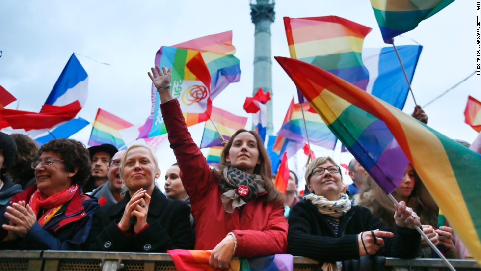 People holding rainbow flags attend the event Concert pour tous! (Concert for all!) on May 21 at Place de la Bastille square in Paris. The concert was a countermovement in reference to the French anti-gay marriage movement Manif pour tous (Demonstration for all), and celebrated the legalization of same-sex marriage.