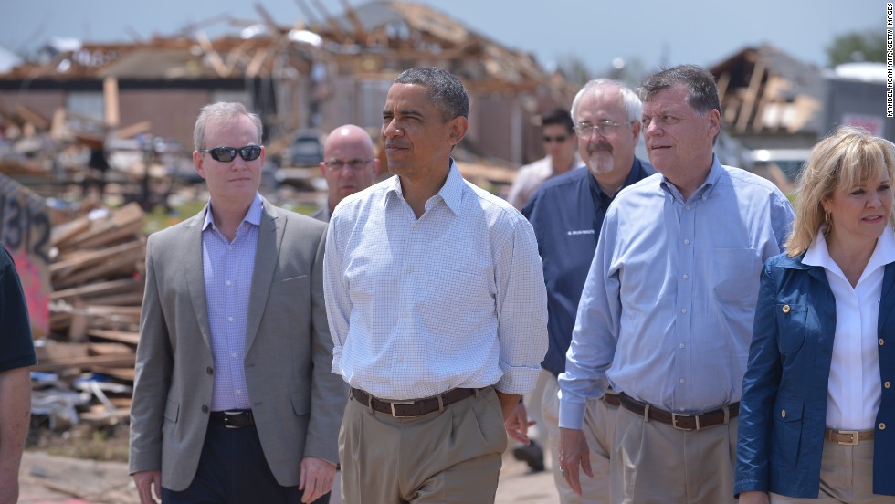 Obama tours a tornado-affected area in Moore, Oklahoma, in May 2013. A tornado that ripped through Moore hit 2,400 homes on a 17-mile path.