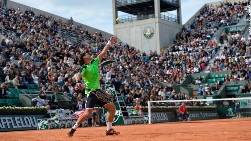 Spain&#39;s David Ferrer serves to Australia&#39;s Marinko Matosevic during the first round of the French Open on Sunday, May 26, in Paris. Ferrer won the match 6-4, 6-3, 6-4. 