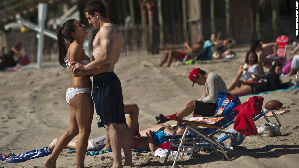 Sunbathers celebrate the Memorial Day weekend in Long Branch, New Jersey, on Monday, May 27. Jersey Shore beaches are reopening as the region recovers from Hurricane Sandy. 