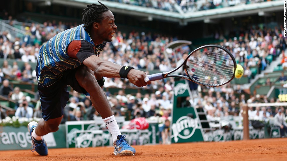 France&#39;s Gael Monfils stretches for a shot against Czech Republic&#39;s Tomas Berdych during the first round of the French Open on Monday, May 27, at the Roland Garros stadium in Paris. Monfils defeated Berdych 7-6(8), 6-4, 6-7(3), 6-7(4), 7-5.