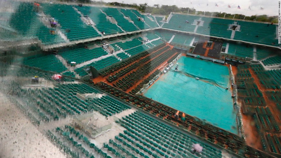 Rain causes delays on the third day of the French Open in Paris, on May 28, as a covering tries to keep the Philippe Chatrier central court at Roland Garros stadium dry. 