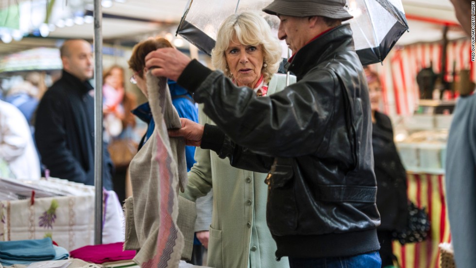 Camilla makes an unannounced visit to a street market and talks with the vendors.
