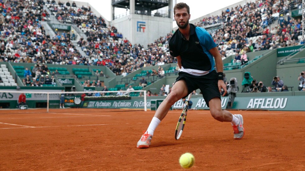 France&#39;s Benoit Paire misses a shot from Cyprus&#39; Marcos Baghdatis on May 29. Paire defeated Baghdatis 3-6, 7-6(1), 6-4, 6-4.