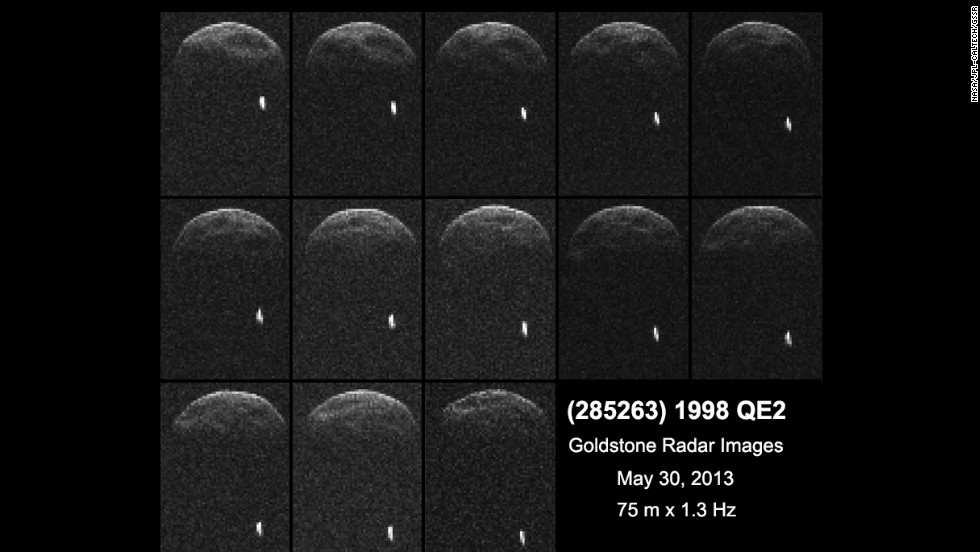 Asteroid 1998 QE2 is about 3.75 million miles from Earth. The white dot is the moon, or satellite, orbiting the asteroid.