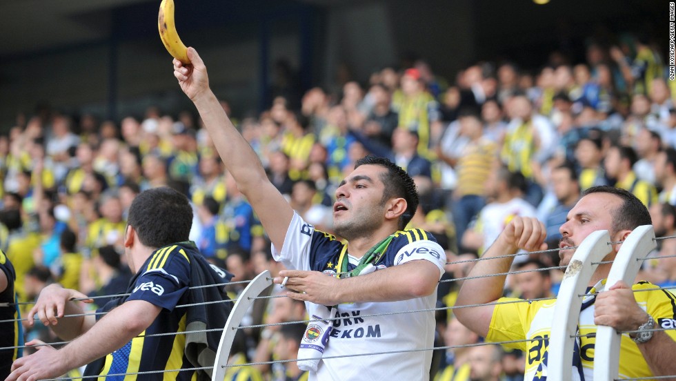 Racism has long been a stain on football but a resurgence of incidents in recent years has prompted soccer&#39;s authorities to launch a renewed bid to rid the game of discrimination for good. Here a Fenerbahce fan holds a banana towards Galatasaray&#39;s Ivory Coast striker Didier Drogba during a Turkish league match in May 2013.