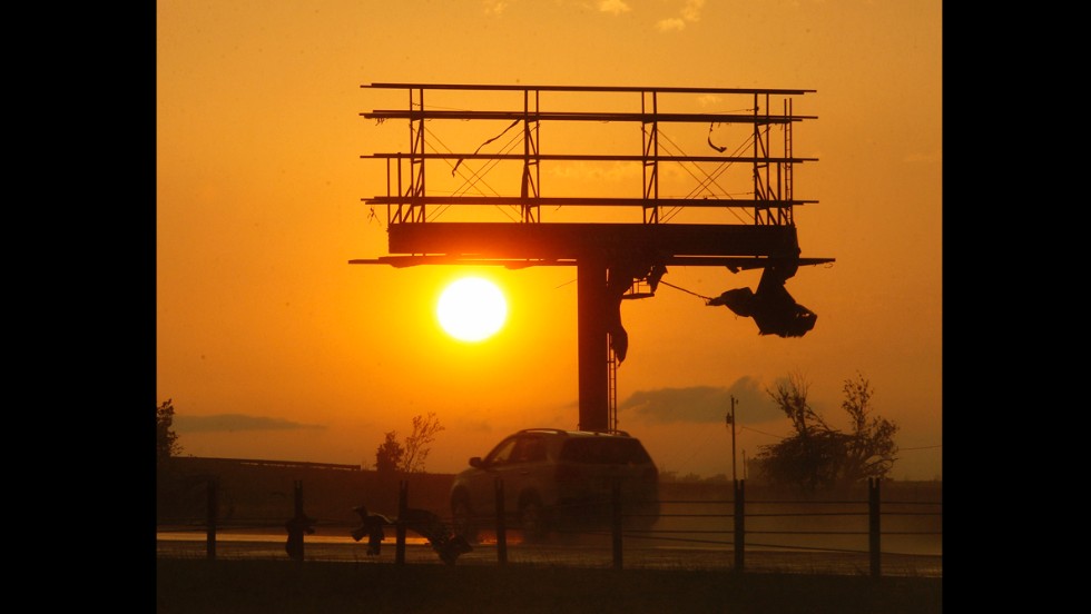 Tornado debris hangs from a billboard sign, which was destroyed along Interstate-40 near El Reno on May 31.