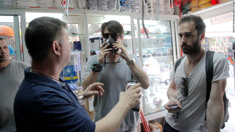 Protesters buy gas masks from a local shop near the square on June 1.