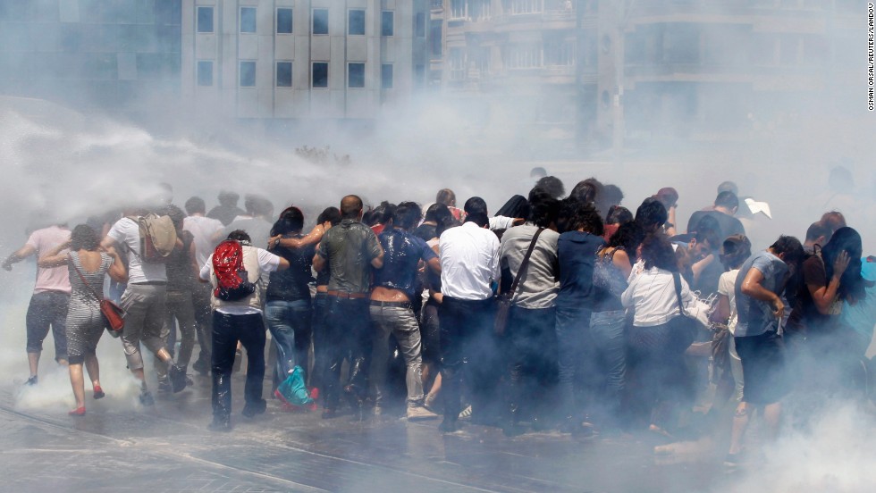 Riot police use tear gas and water cannons to disperse a crowd at Taksim Square on May 31.