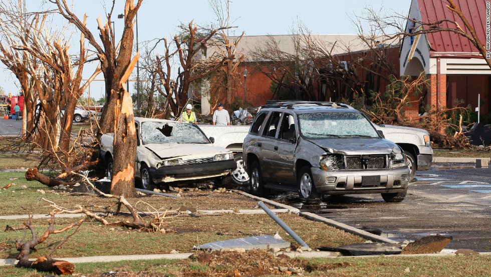 Destroyed trees and cars stand along a road at the Canadian Valley Technology Center in El Reno on June 1.