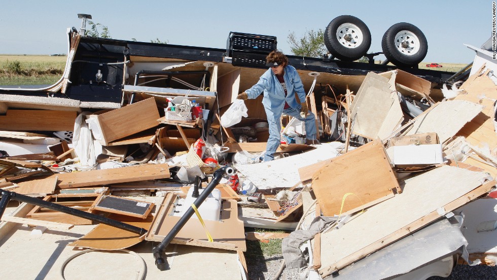 Mikie Hooper collects her belongings from her RV, which was destroyed by a tornado in El Reno, Oklahoma, on June 1.