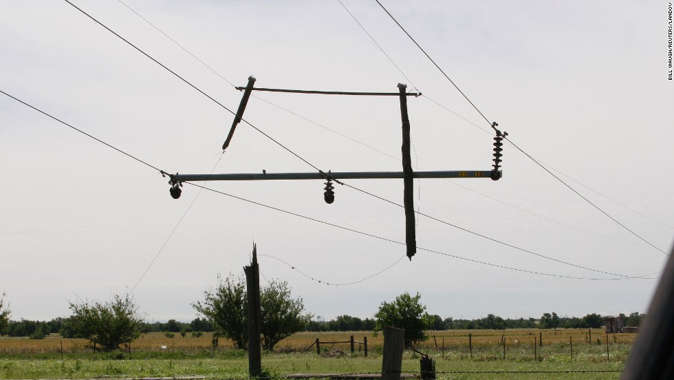 The tornado severed the pole supporting these power lines, leaving the remnants dangling near El Reno on June 1.