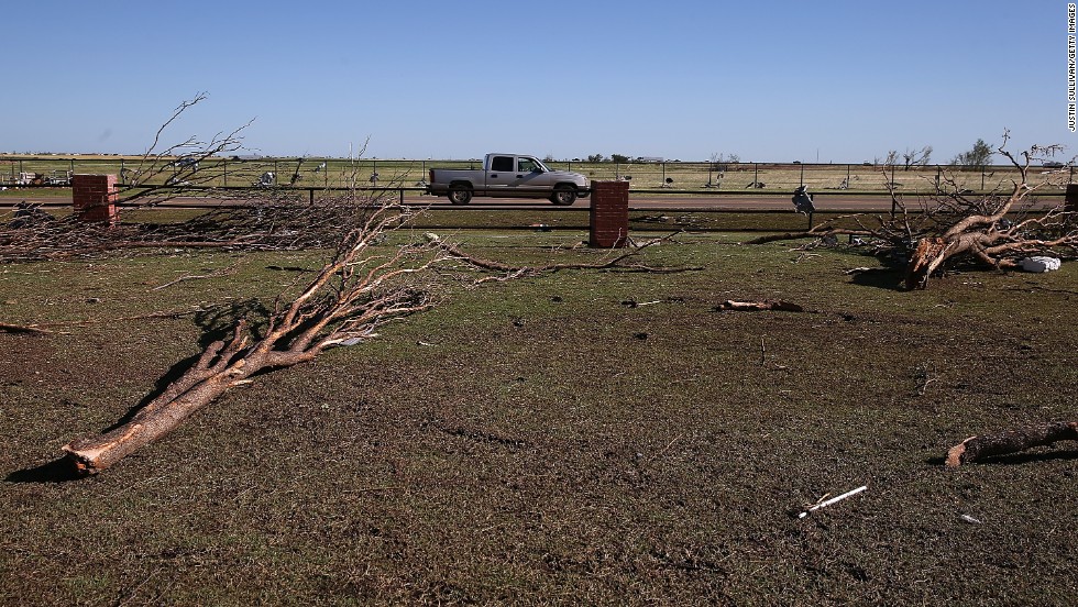 Downed trees sit in the parking lot of the Canadian Valley Technology Center in El Reno on June 1.