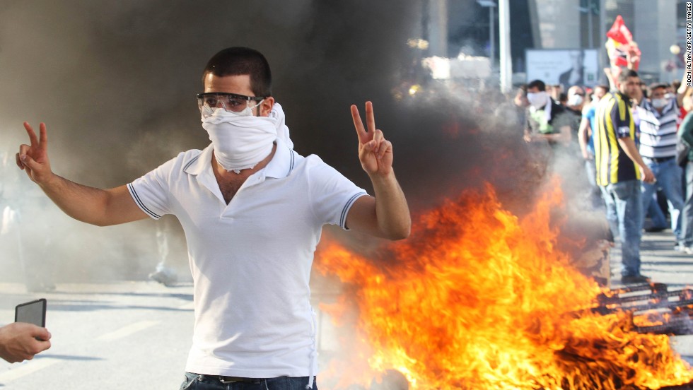 A protester flashes a victory sign as he takes part in a demonstration in Ankara on Saturday, June 1 in support of the protests in Istanbul against  government plans to demolish a park. 