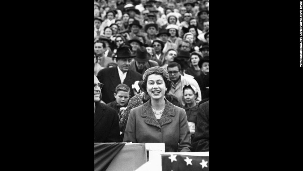 Queen Elizabeth II watches a University of Maryland vs. University of North Carolina football game at Maryland&#39;s Byrd Stadium during her 1957 official visit to the United States.