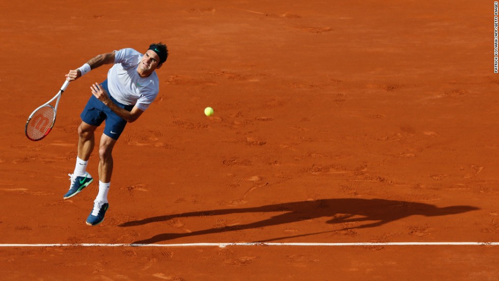 Switzerland&#39;s Roger Federer serves to Gilles Simon of France during a fourth-round match of the French Open on Sunday, June 2, in Paris. Federer defeated Simon 6-1, 4-6, 2-6, 6-2, 6-3.
