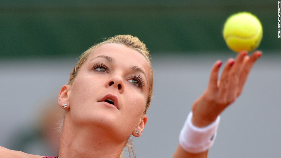 Poland&#39;s Agnieszka Radwanska serves to Serbia&#39;s Ana Ivanovic on June 2. Radwanska won 6-2, 6-4.