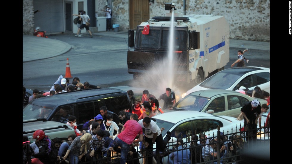 Police use a water cannon to disperse protesters outside Turkish Prime Minister Recep Tayyip Erdogan&#39;s working office in Istanbul on June 2.
