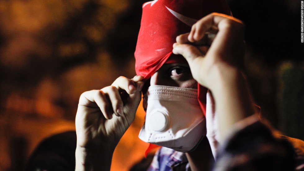 A protester covers his face on June 3 near Erdogan&#39;s office in Istanbul. 