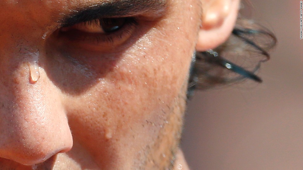 Sweat runs down the face of Spain&#39;s Rafael Nadal during his match against Japan&#39;s Kei Nishikori at the French Open on Monday, June 3, in Paris.