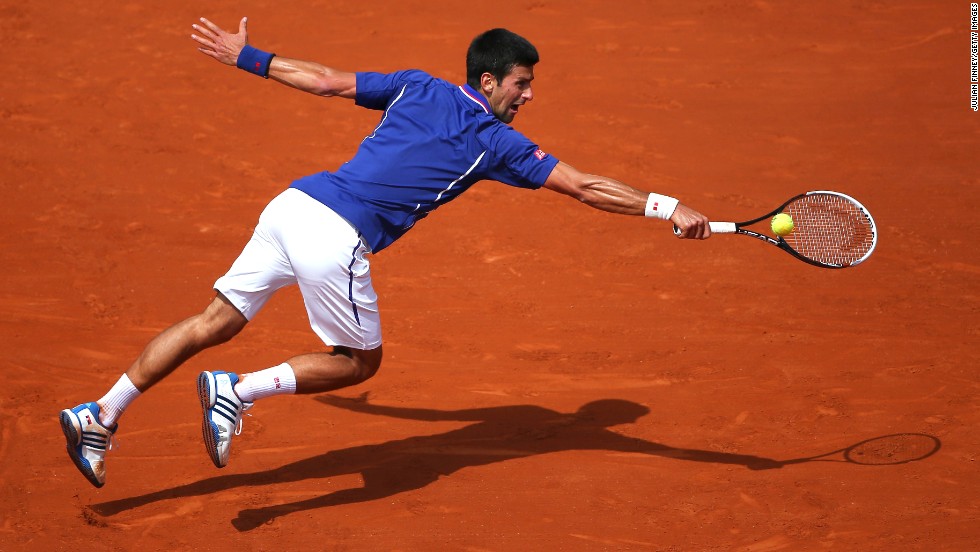 Serbia&#39;s Novak Djokovic dives for a backhand during his match against Germany&#39;s Philipp Kohlschreiber on June 3.