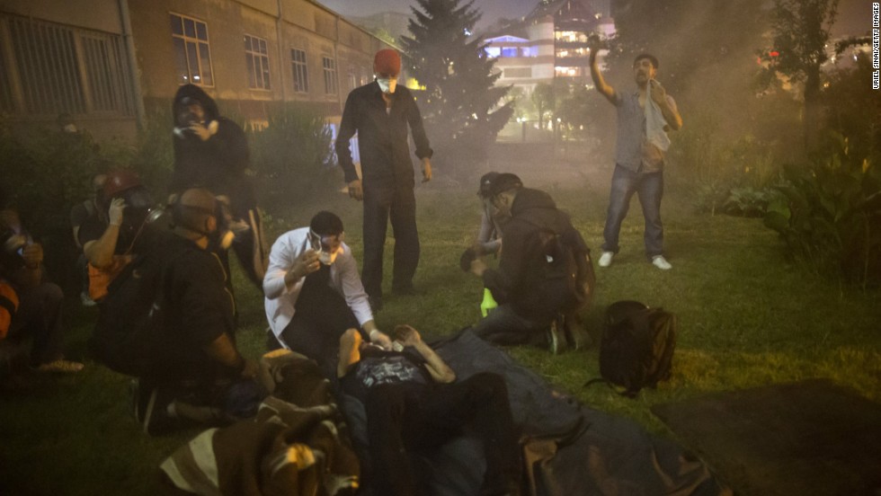 Protester wounds are treated during clashes in Istanbul on June 3.