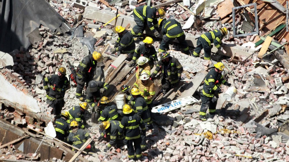 Rescue workers comb through the debris as they search for survivors. 