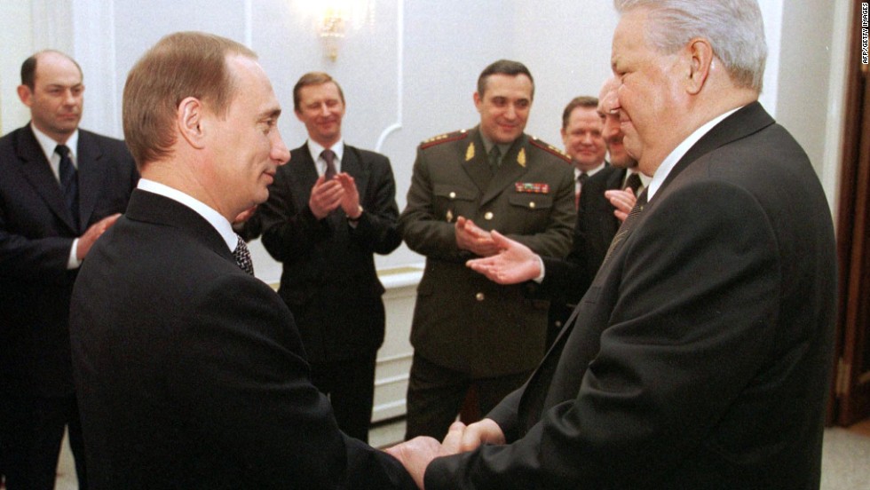 Russian President Boris Yeltsin, right, shakes hands with Putin during a farewell ceremony at the Kremlin in Moscow in December 1999. Putin rose quickly through the political ranks, becoming the second democratically elected president of the Russian Federation in 2000.