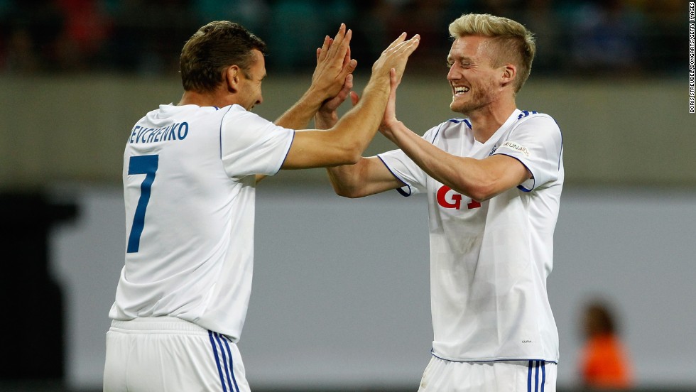 Former Ukraine international Andriy Shevchenko, who played with Ballack at Chelsea, and Bayer Leverkusen&#39;s Andre Schurrle, who has been linked with a move to London, celebrate the latter&#39;s goal in a match that ended 4-3 to the German XI. Ballack scored a hat-trick.