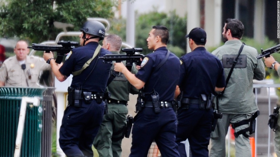 Los Angeles Police Department officers along with Los Angeles County Sheriff deputies search the campus of Santa Monica College after a reported shooting on Friday, June 7.  