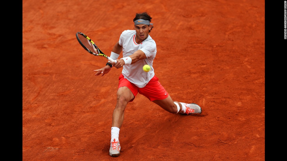 Nadal plays a backhand against Ferrer.