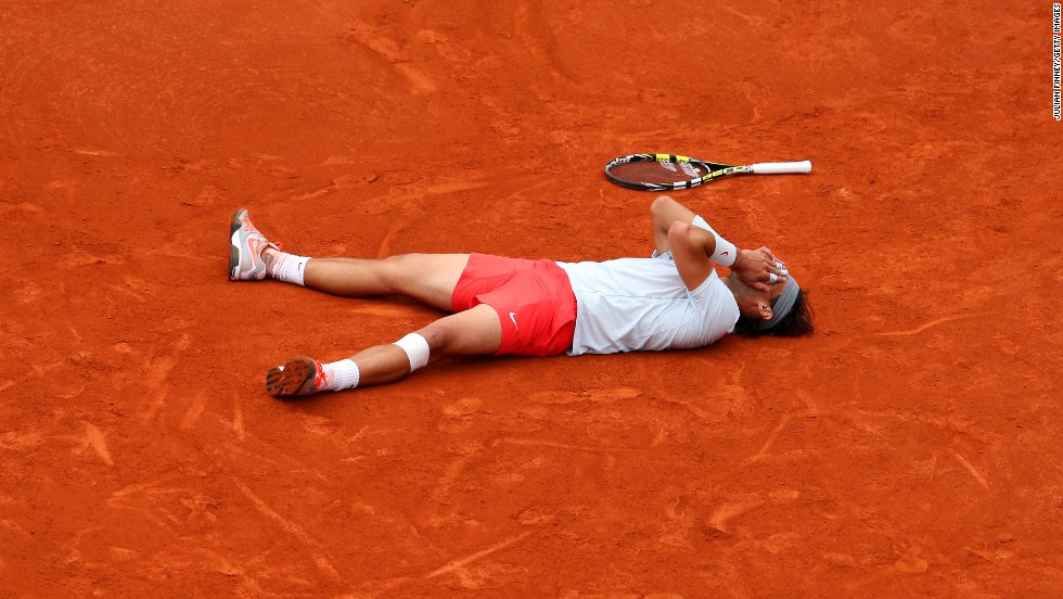 Rafael Nadal of Spain reacts after getting match point against David Ferrer of Spain during the men&#39;s singles final match of the French Open at Roland Garros Stadium in Paris, on Sunday, June 9. Nadal won 6-3, 6-2, 6-3