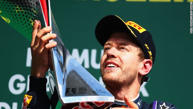 Sebastian Vettel claims the winning trophy in Montreal at last as he extends his title lead.