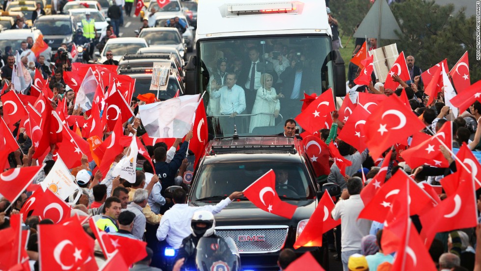 Turkish Prime Minister Recep Tayyip Erdogan, left, and his wife, Emine, wave to supporters upon their arrival in Ankara on June 9. Erdogan told supporters that &quot;even patience has an end&quot; as he went on the offensive against mass protests that have consumed Ankara and Istanbul.