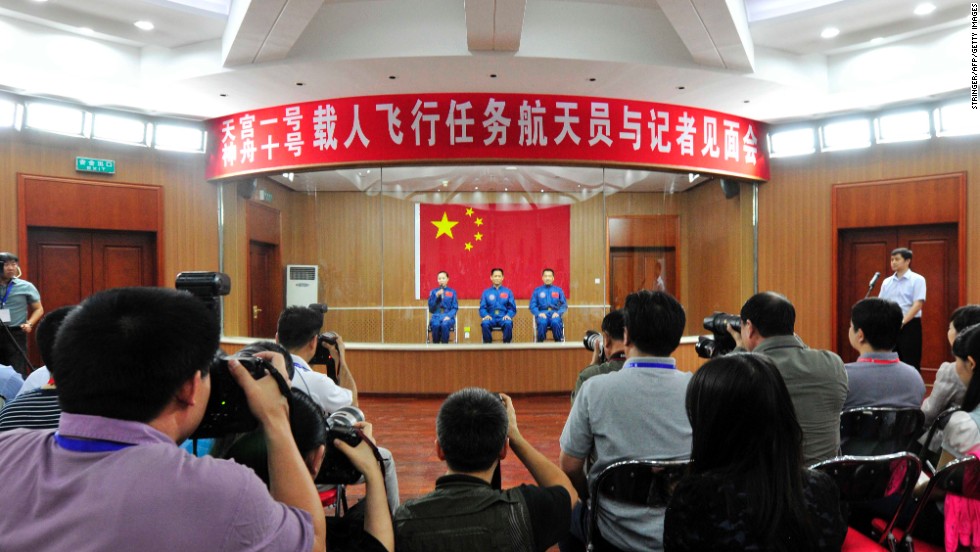 The crew attend a press conference in Jiuquan on Monday, June 10.