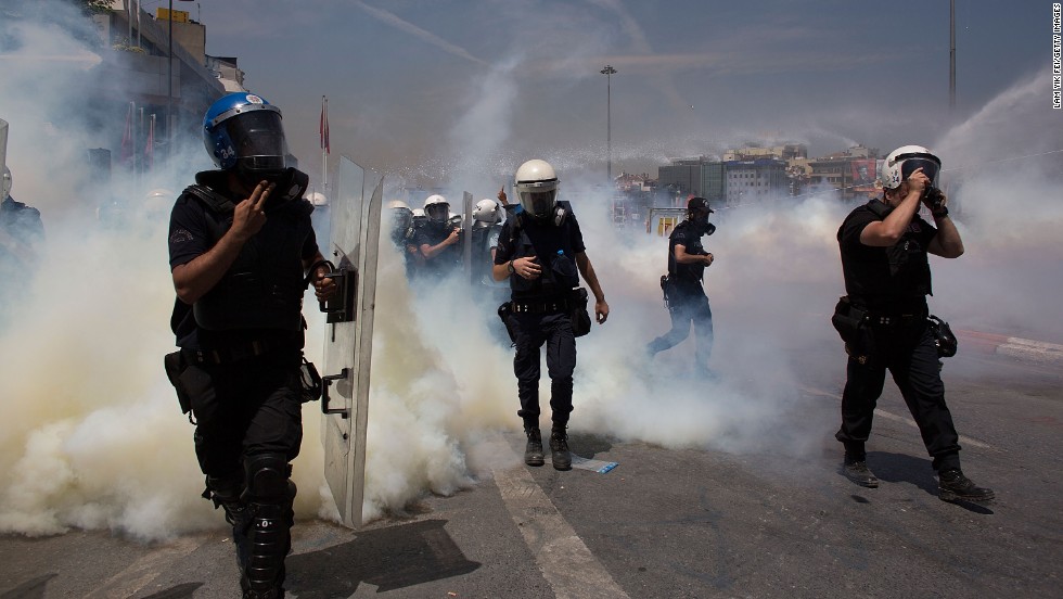 Riot police use water cannons and tear gas to disperse a crowd near Istabul&#39;s Taksim Square on June 11.