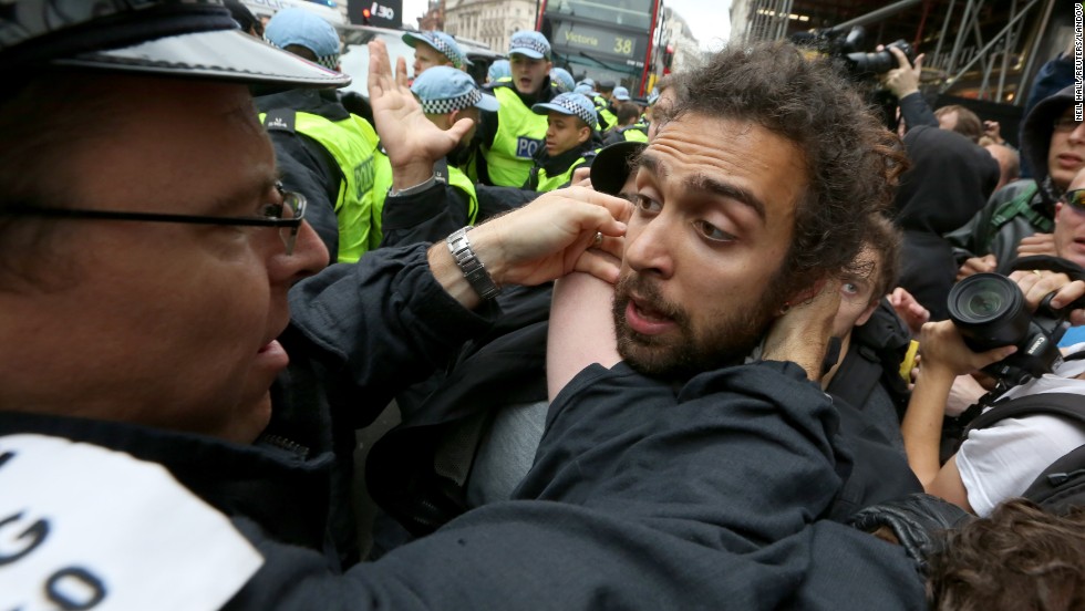 A police officer scuffles with a protester in Soho on June 11.