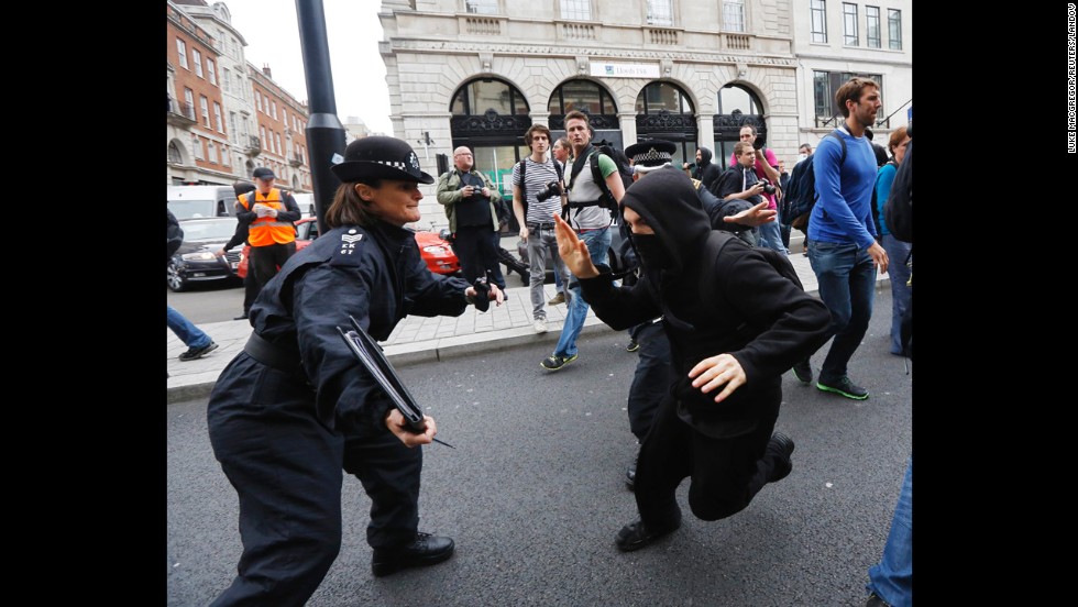  A protester tries to evade a police officer in Soho on June 11.