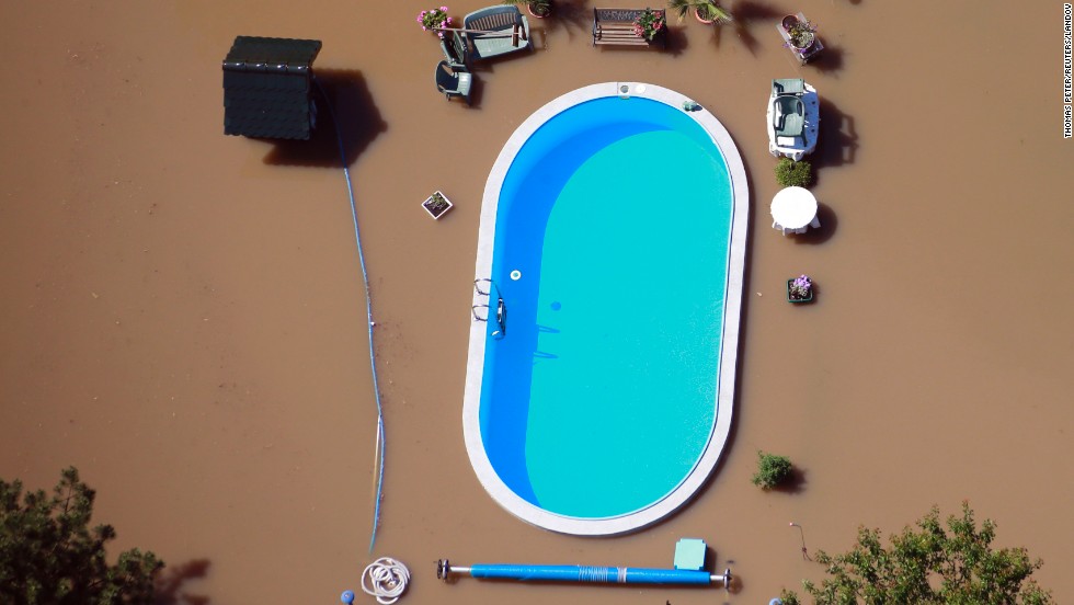 &lt;a href=&quot;http://www.cnn.com/2013/06/11/world/europe/europe-flood/index.html&quot;&gt;Floodwaters from the Elbe River&lt;/a&gt; inundate a yard with a swimming pool near Magdeburg, Germany, on Monday, June 10. Heavy rain has left rivers swollen across Central Europe.