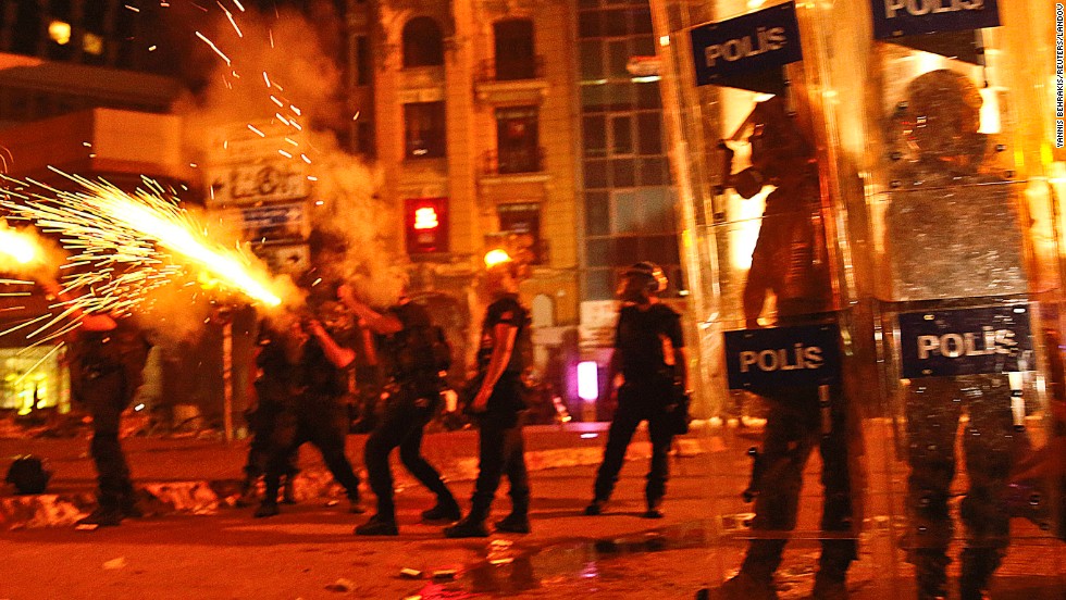 Riot police fire tear gas canisters at protesters in Taksim Square on June 11.