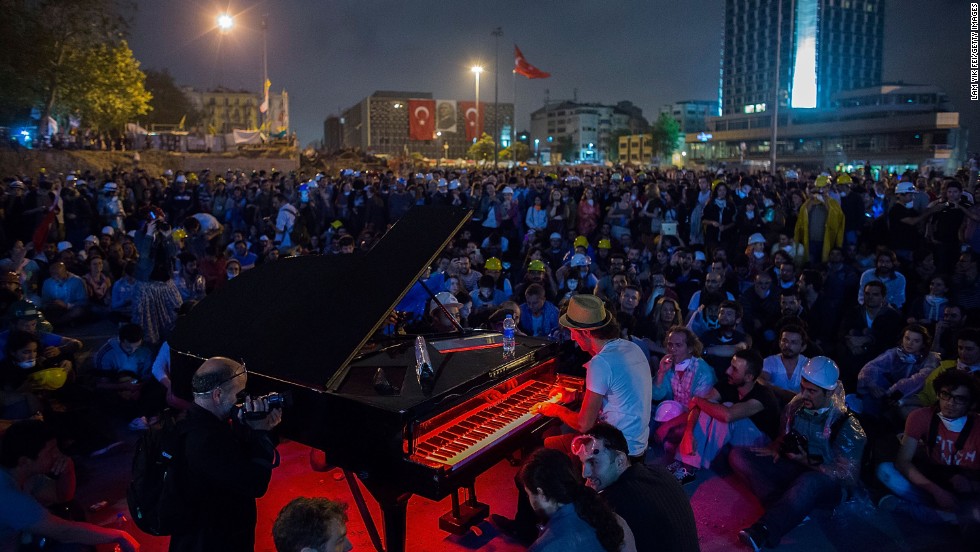 A man plays piano for hundreds of protesters in Taksim Square on Wednesday, June 12, in Istanbul.